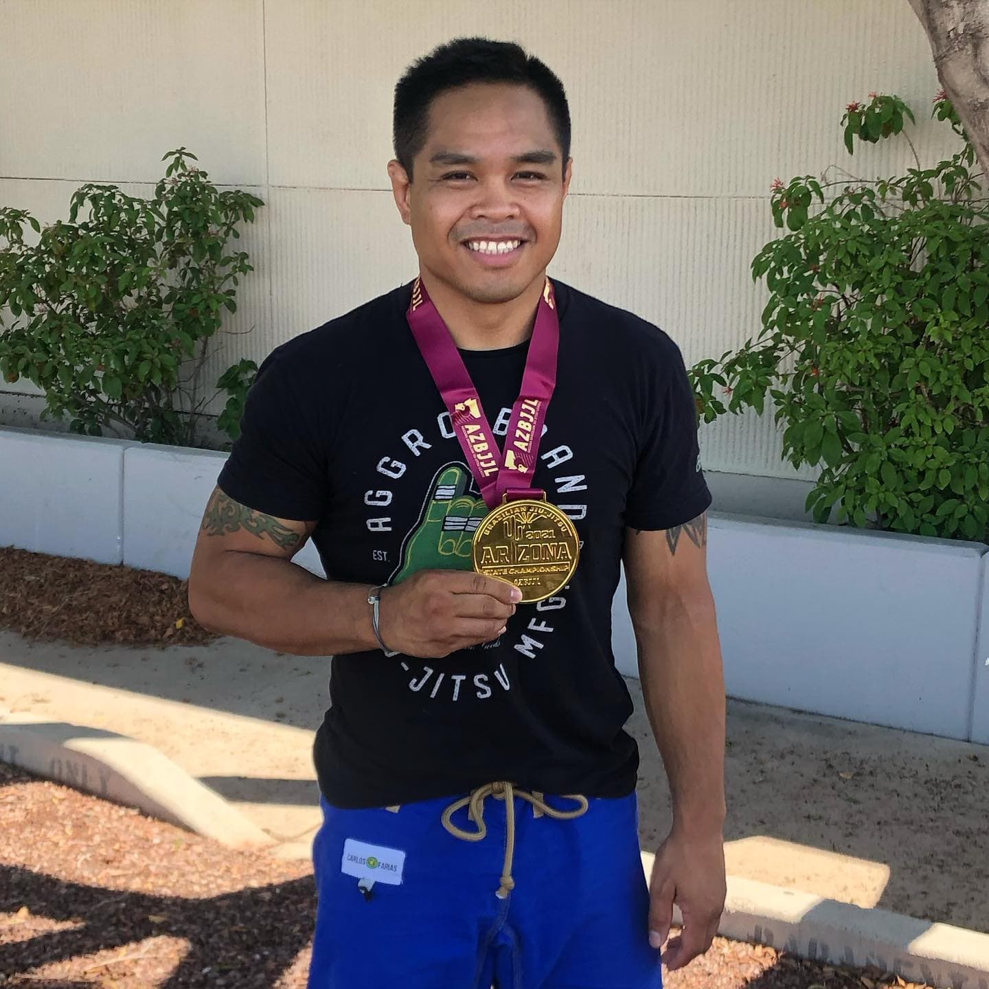Coach Rhett with an Arizona State Championship gold medal