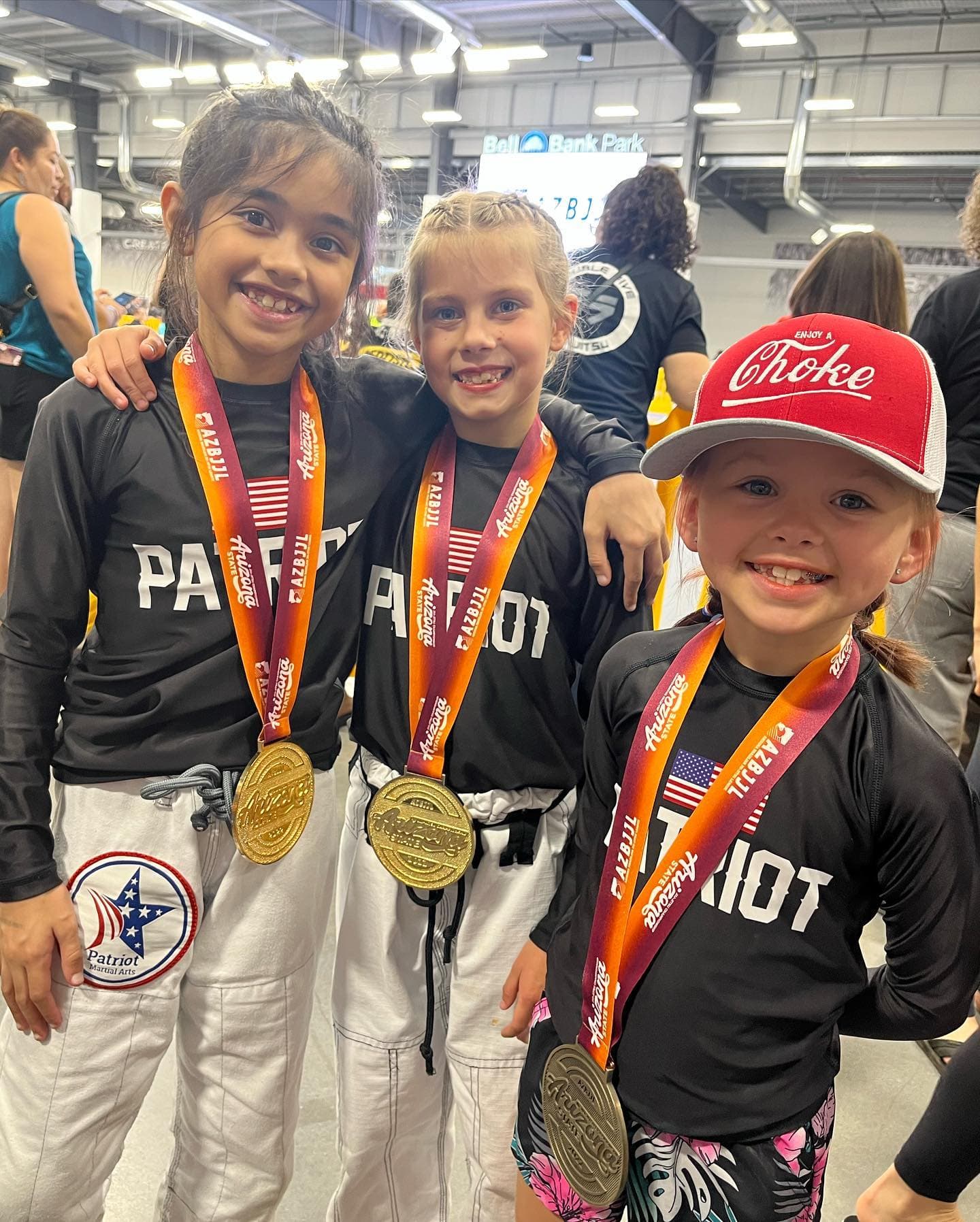 Patriot kids showing off their tournament medals