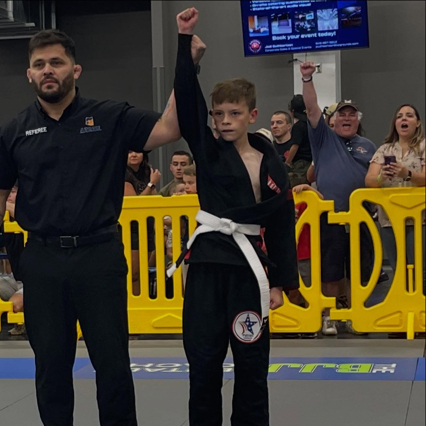 Young student celebrating a win on the podium